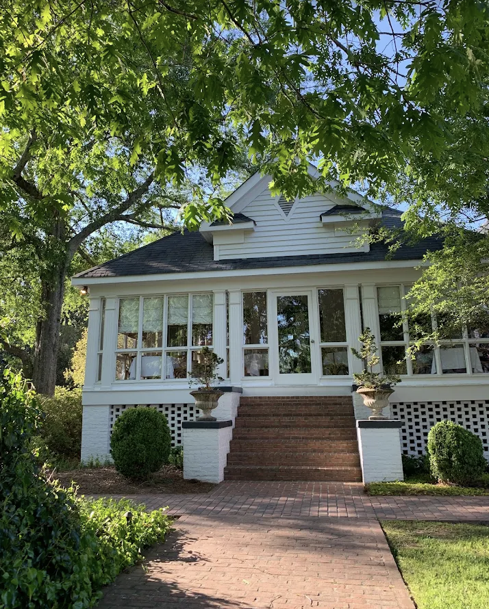 Exterior of The Farmhouse farm-to-table restaurant in Serenbe surrounded by trees