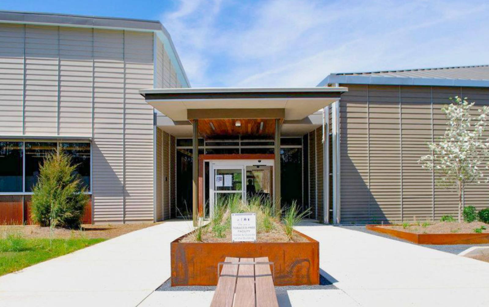 Palmetto Branch Library entrance building in Palmetto, Georgia with modern exterior architecture and landscaped walkway.